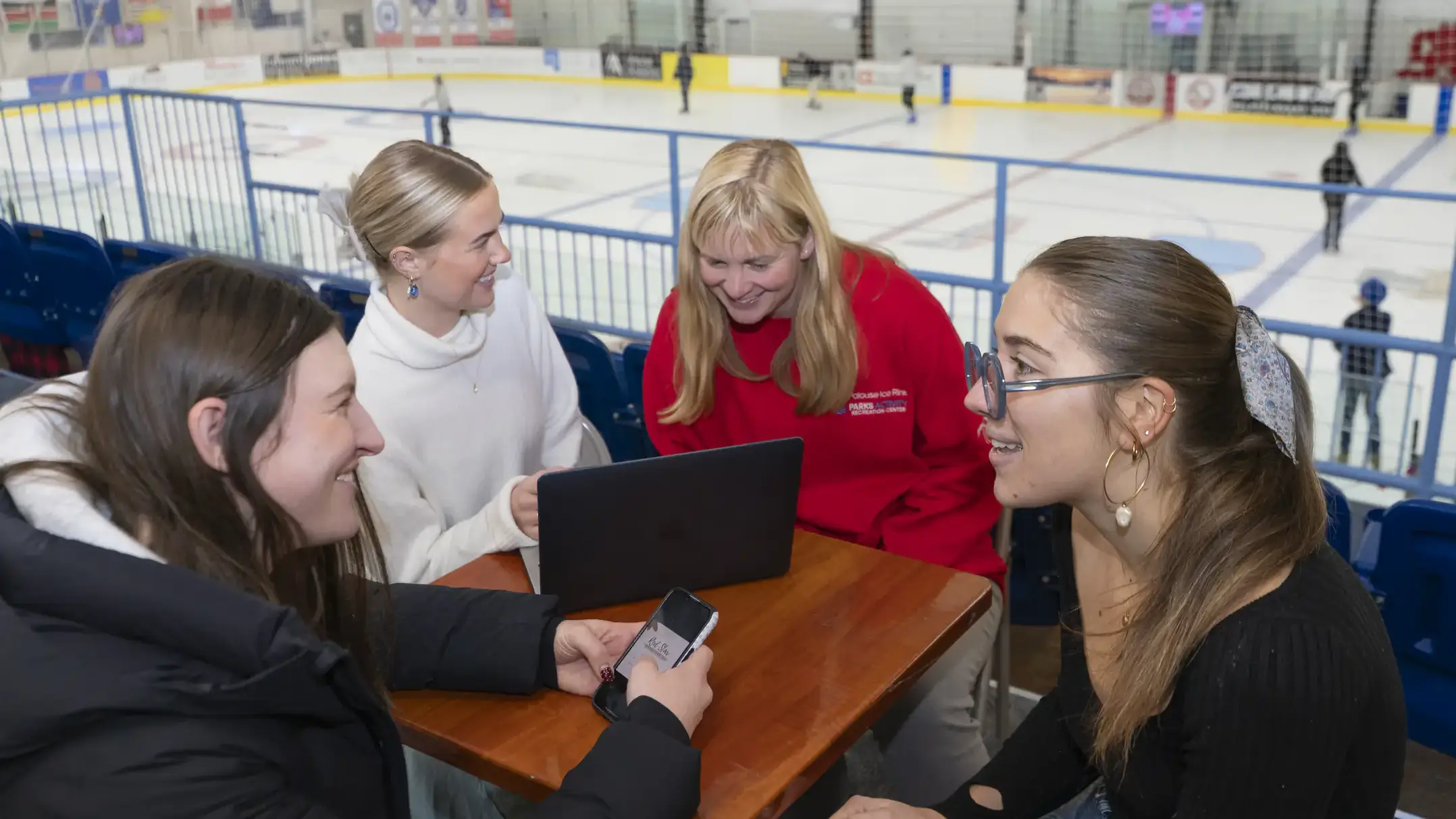 University of Idaho students in the Vandal Solutions program are assisting the Palouse Ice Rink in Moscow, ID with marketing projects. Pictured from left are: Peyton Watson, Maggie Meyer, Palouse Ice Rink manager Laura Wold-Morford, Lucy Bleu McDougald.