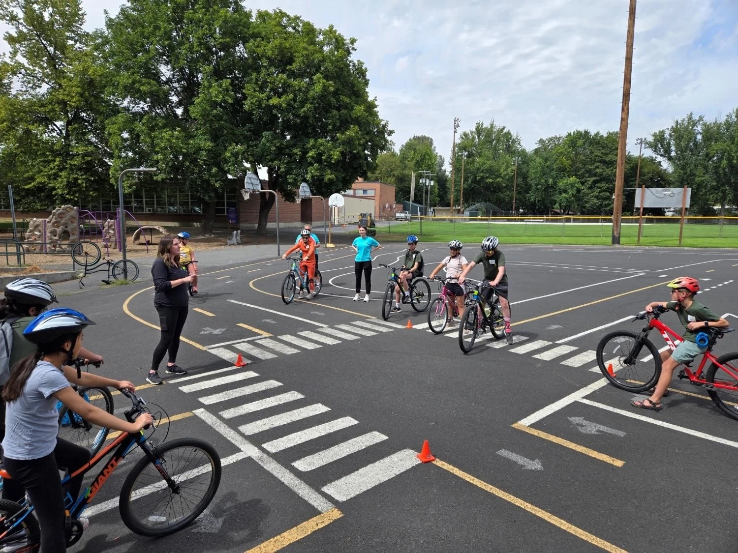Children on bikes on playground