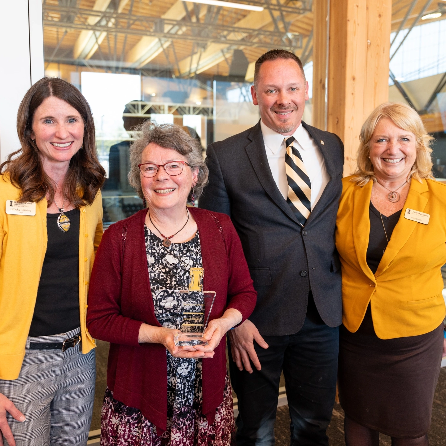 University Advancement Alumni Relations and Marion Patterson '78 at the Latah County Silver &amp; Gold awards in the Idaho Central Credit Union Arena Alumni Lounge.