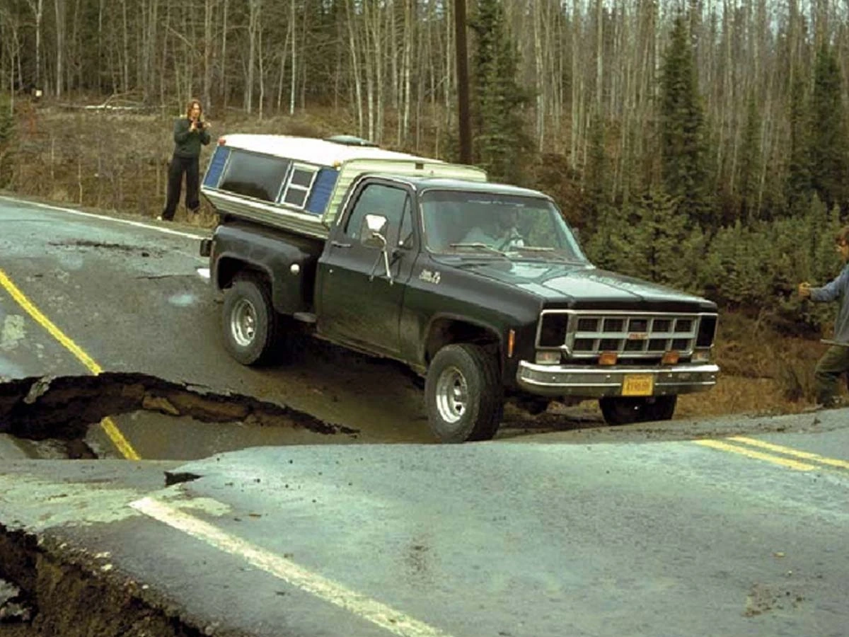 Thermokarst landscape of a truck sinking in a road