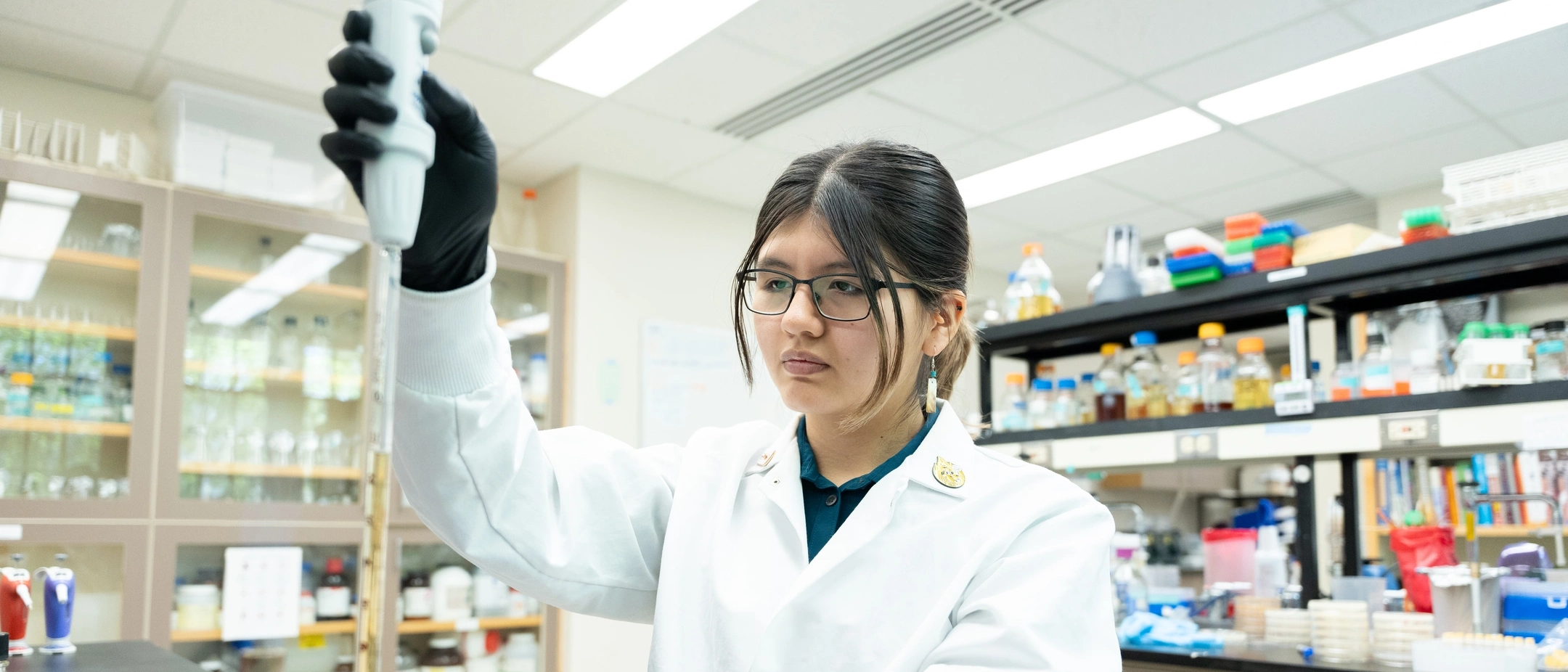 Goldwater scholar Dayna Bruiton from Caldwell, Idaho working in the Paul Rowley lab working with Yeast growth medium.