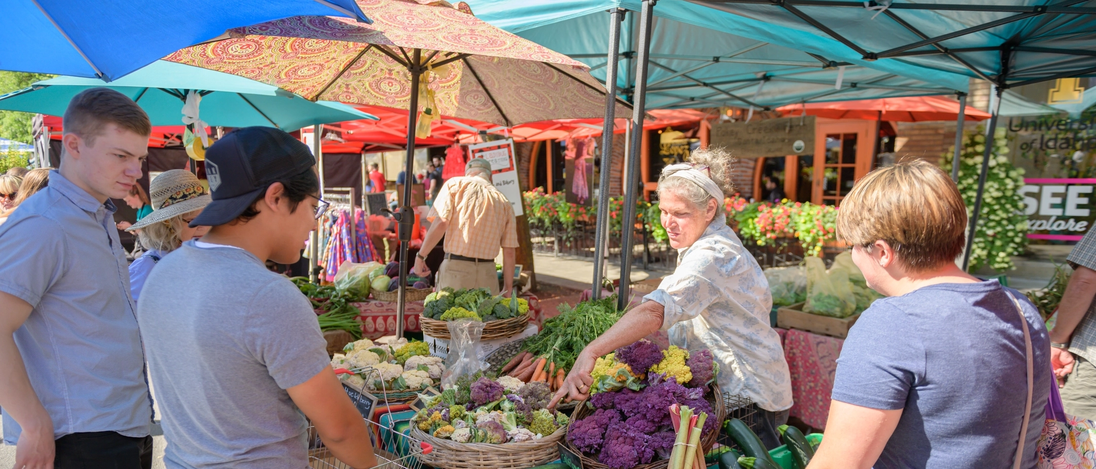 Students and community members gather on Main Street for Moscow Farmer's Market summer 2019