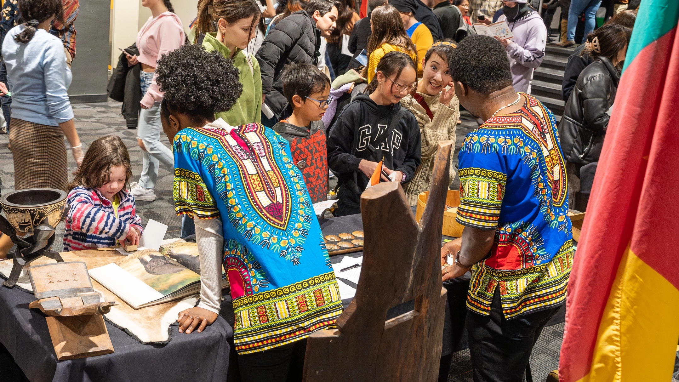 Volunteers share information about their cultures at booths