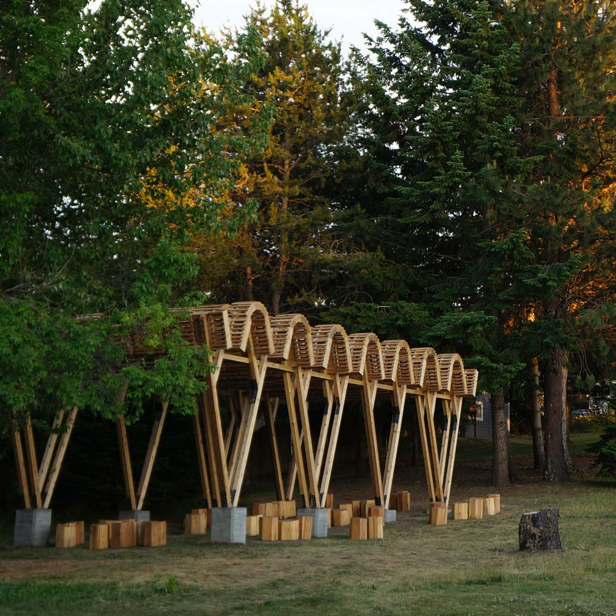 The completed McDonald Elementary Outdoor Classroom stands near trees and gardens on the school grounds.