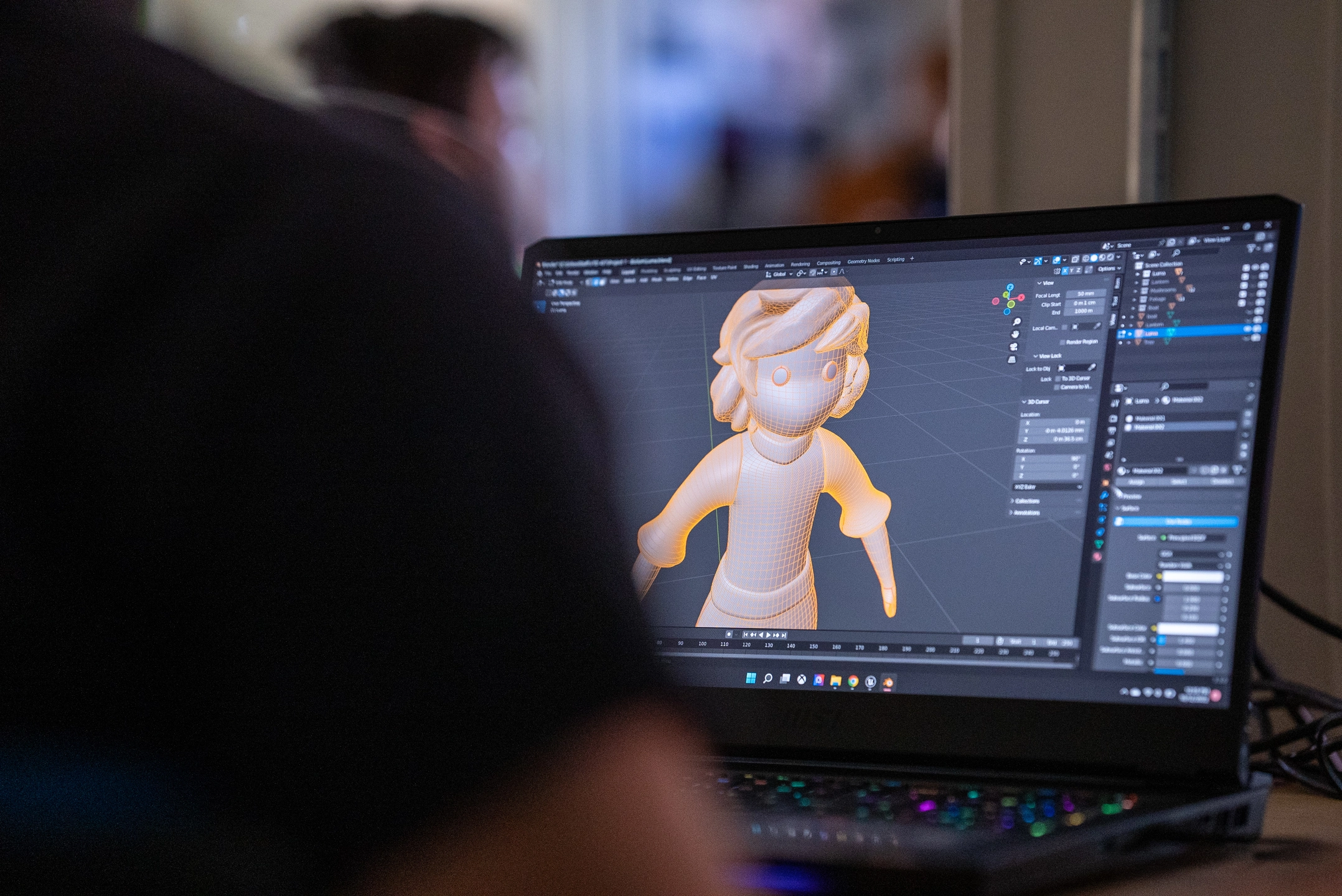 Spencer Cuppage working on 3D model of a child.
